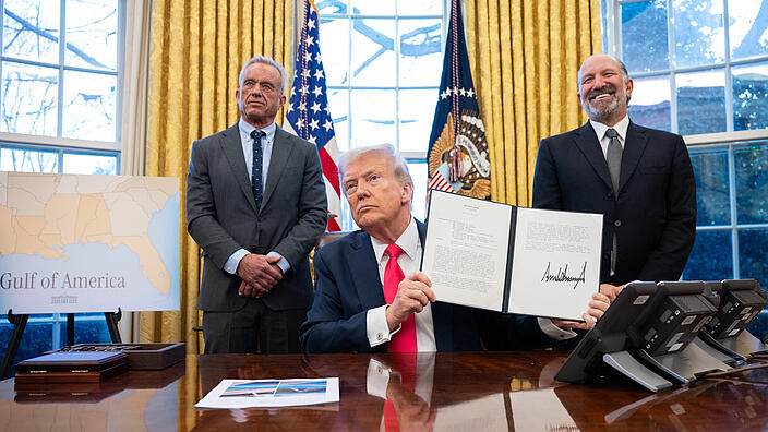 President Donald Trump signs executive orders in the Oval Office, Tuesday, February 25, 2025
